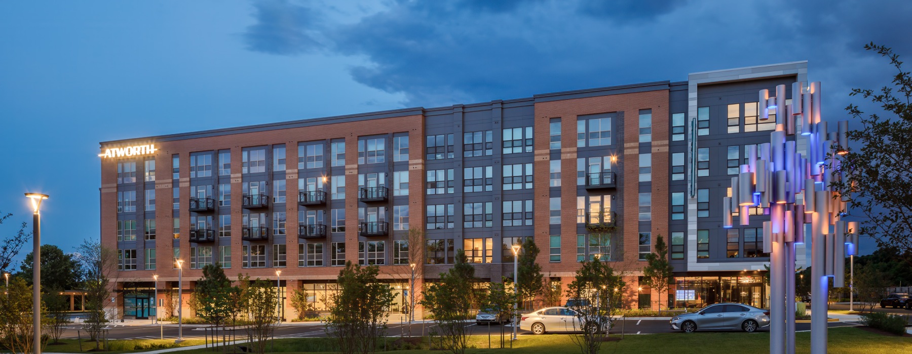 Night shot of the exterior of Atworth Apartments