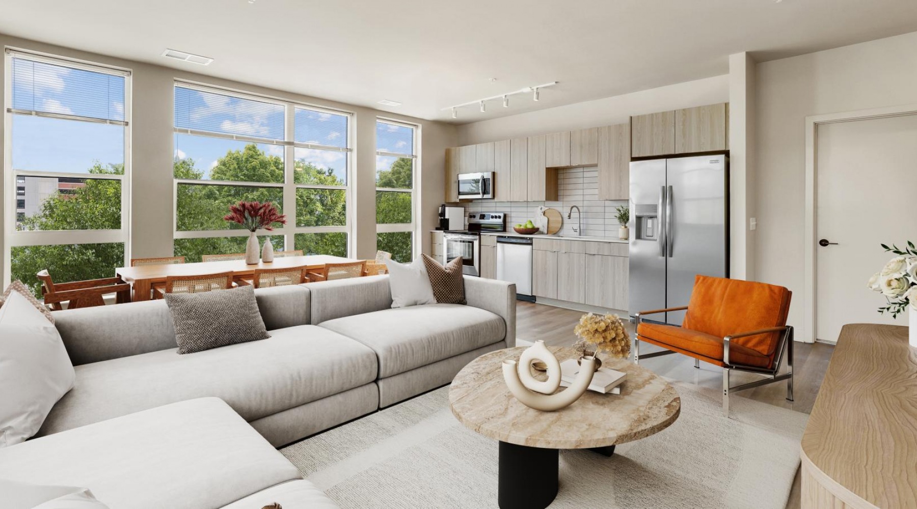 Generous living spaces with beautiful natural lighting a living room with a large window